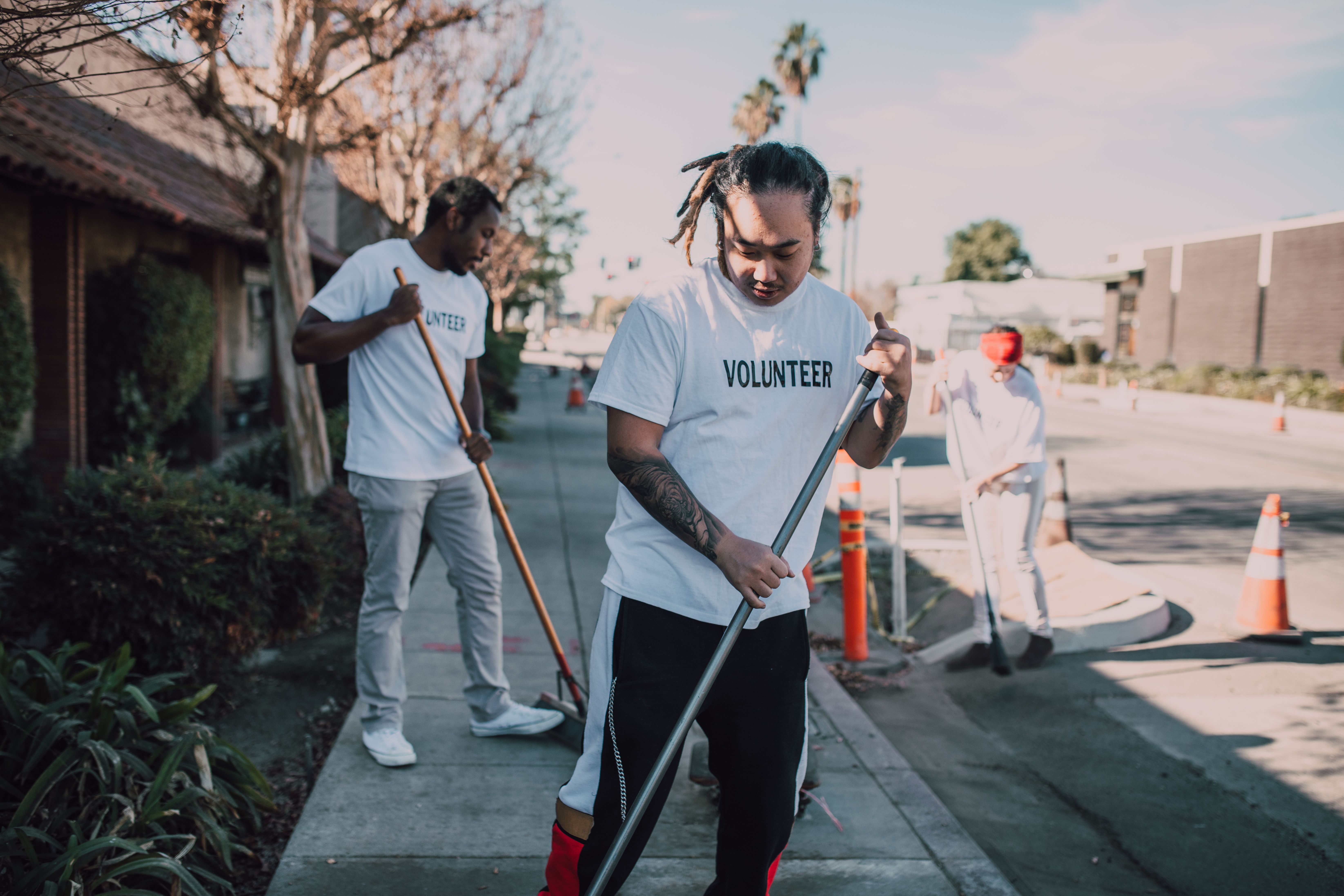 Community volunteers cleaning a neighborhood street together